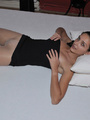 Lusty Mika on her bed just in black tube - Picture 3