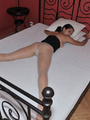 Lusty Mika on her bed just in black tube - Picture 5