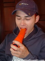 An orange dildo is going to and through - Picture 2
