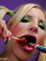 Lollipop sucking blonde girl taking off - Picture 12